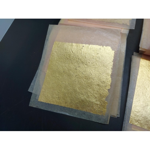 138 - Approx. fifty sheets of 23.5ct yellow gold leaf transfers - approx. 8cm x 8cm