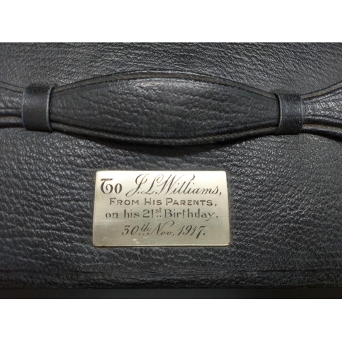 143 - An early 20th century black leather gents travel case with engraved 21st birthday plaque to top - ap... 