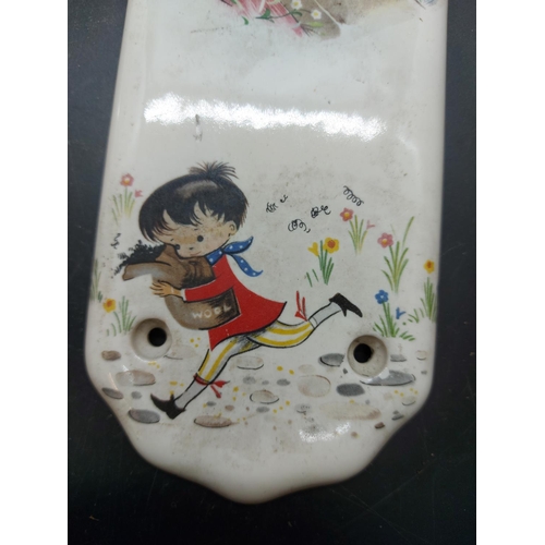 151 - Two mid 20th century porcelain push plates in the manner of Mabel Lucie Atwell with impressed marks ... 