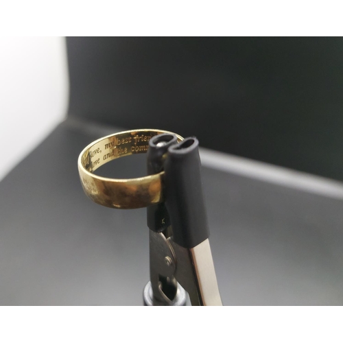 97 - A hallmarked 9ct gold wedding band with single inset diamond and inscription 