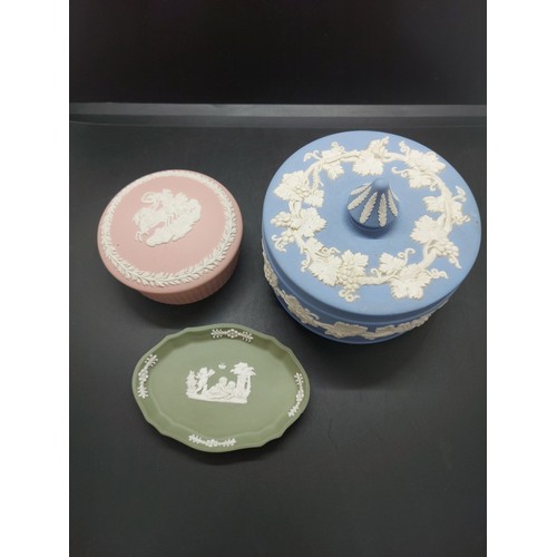 154B - Three pieces of Wedgwood Jasperware to include one pink circular lidded trinket box, one large blue ... 