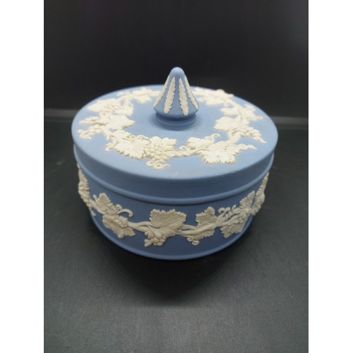 154B - Three pieces of Wedgwood Jasperware to include one pink circular lidded trinket box, one large blue ... 