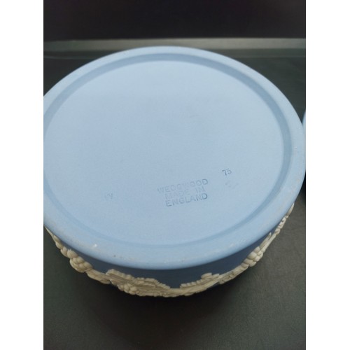 154B - Three pieces of Wedgwood Jasperware to include one pink circular lidded trinket box, one large blue ... 