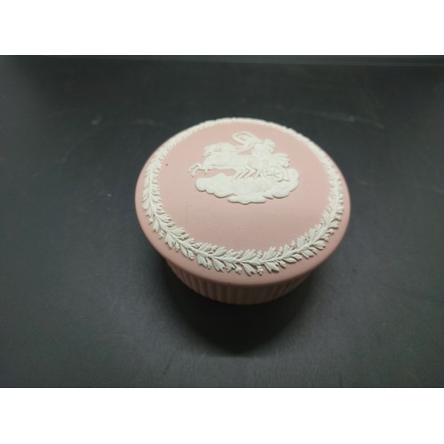 154B - Three pieces of Wedgwood Jasperware to include one pink circular lidded trinket box, one large blue ... 