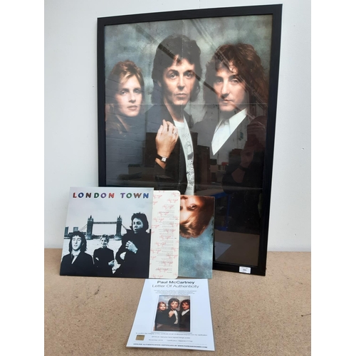 1001 - Two items, one framed Wings poster hand signed by Paul McCartney with certificate of authenticity an... 