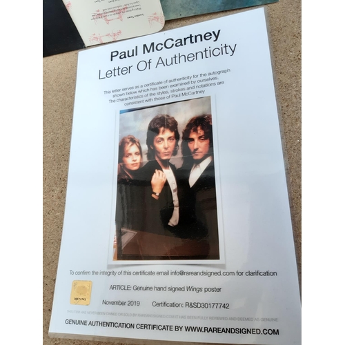 1001 - Two items, one framed Wings poster hand signed by Paul McCartney with certificate of authenticity an... 