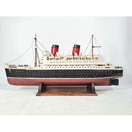 159 - A scratch built model of The RMS Queen Elizabeth ocean liner originally by Cunard with a solid wood ... 