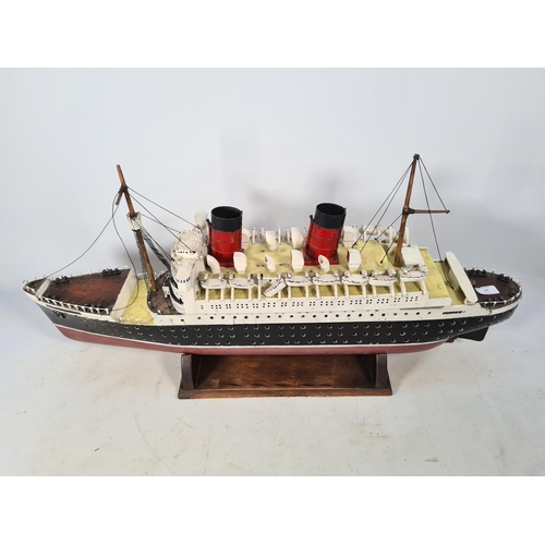 159 - A scratch built model of The RMS Queen Elizabeth ocean liner originally by Cunard with a solid wood ... 