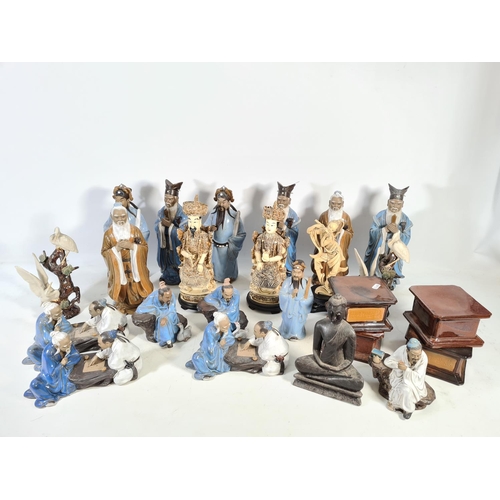 113 - A collection of various oriental ceramics and ornaments to include sixteen ceramic figurines, four c... 