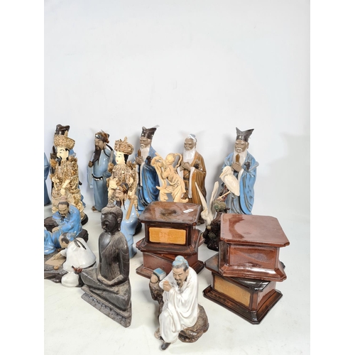 113 - A collection of various oriental ceramics and ornaments to include sixteen ceramic figurines, four c... 