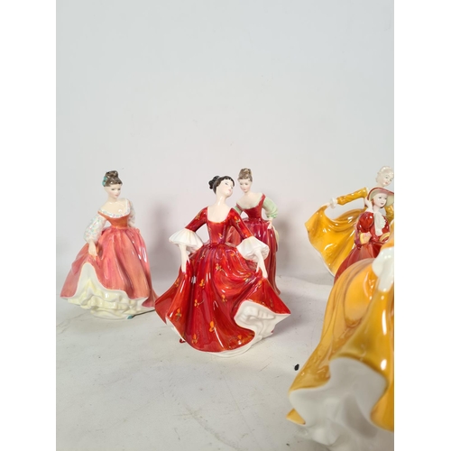 116 - Twelve Royal Doulton figurines to include two 'Fair Lady' HN 2832, two 'Kirsty' HN 2381, 'Buttercup'... 