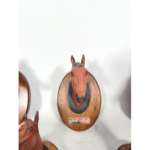 117 - Five Beswick horse wall plaques to include Red Rum, Arkle etc.