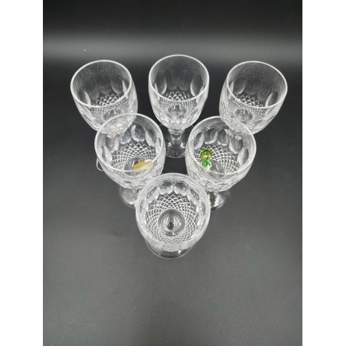 102 - Eight pieces of Waterford Crystal glass to include six port glasses, one bell and one circular trink... 