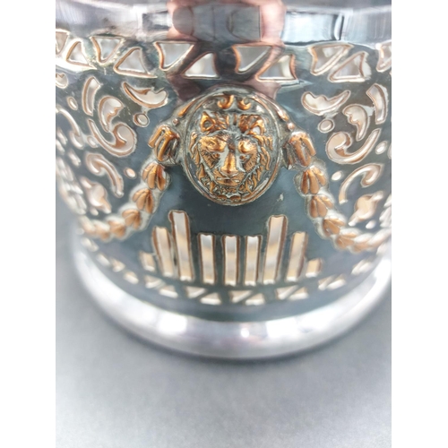 3 - A Victorian silver plate on copper bottle holder with pierced border, lion mask design and acanthus ... 