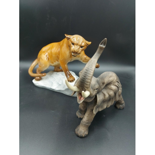 78 - Two ceramic figurines, one Beswick puma on rock model no. 1702 and one matte porcelain elephant with... 