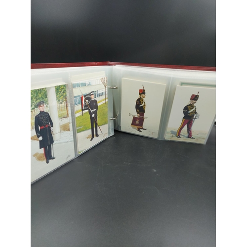 18 - A collection of two hundred mint condition regimental postcards in Stanley Gibbons album displaying ... 