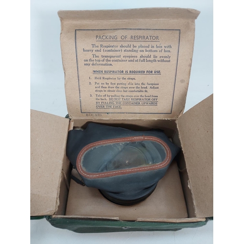 27 - Two WWII British civilians gas masks in original issue boxes with two leather cases