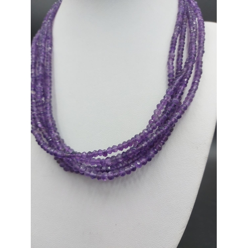 88 - An amethyst four row gemstone necklace with 925 silver clasp - approx. 42cm