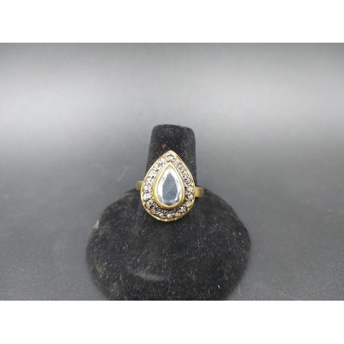 99 - A yellow gold plated 925 silver and flat moissanite diamond ring with outer rose cut diamonds