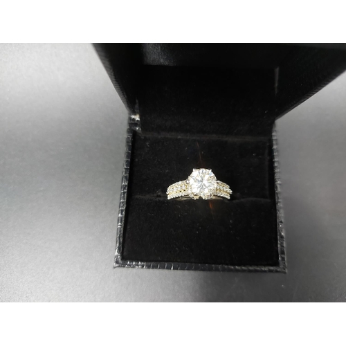 110 - A 925 silver and 1.4ct moissanite ring with outer CZ stones