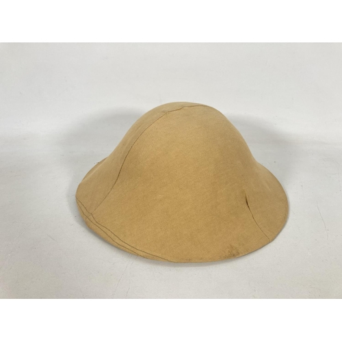 62 - A re-enactors WWI British Brodie helmet and cover