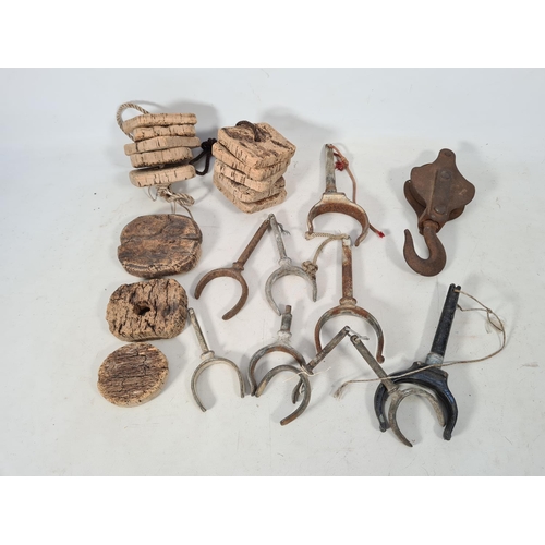 65 - A collection of vintage nautical items to include cork floats, rowing boat rowlocks and one pulley a... 