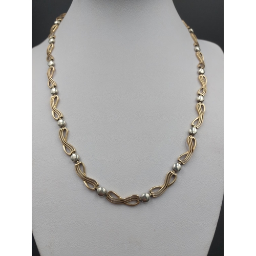 140 - A stamped 9ct yellow and white gold 45cm necklace - approx. gross weight 13.63 grams