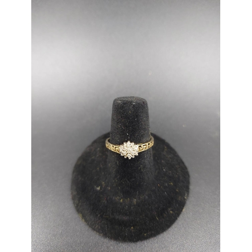 141 - A hallmarked 9ct gold diamond cluster ring, size O - approx. gross weight 1.8 grams