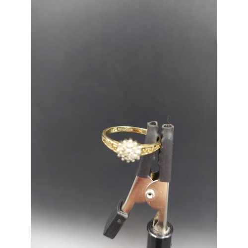 141 - A hallmarked 9ct gold diamond cluster ring, size O - approx. gross weight 1.8 grams