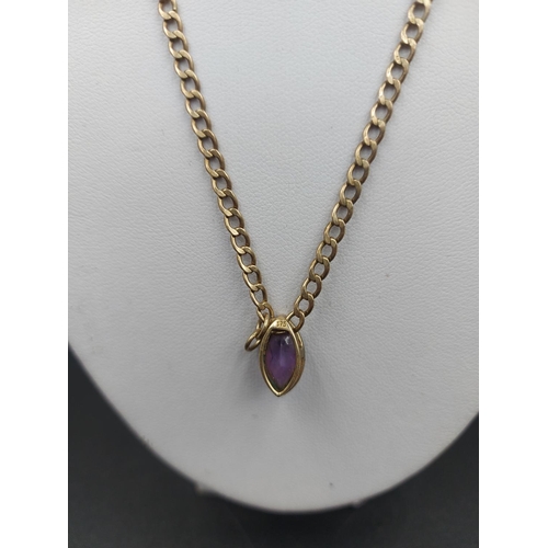 142 - A stamped Italian 9ct gold 47cm necklace with amethyst pendant - approx. gross weight 4.39 grams