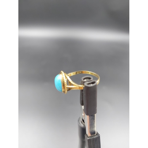 152 - A hallmarked 9ct gold ring with inset oval turquoise stone, size P - approx. gross weight 2.28 grams