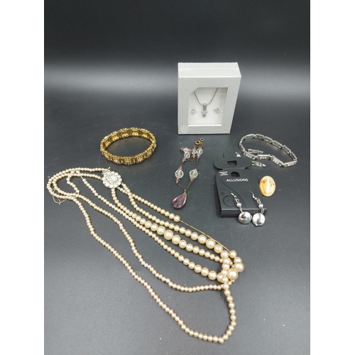 174 - A collection of various costume jewellery to include four simulated pearl necklaces - one with silve... 