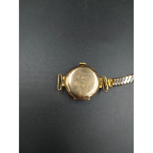 183 - A hallmarked 9ct gold cased ladies watch with later added gold plated elasticated strap - approx. gr... 