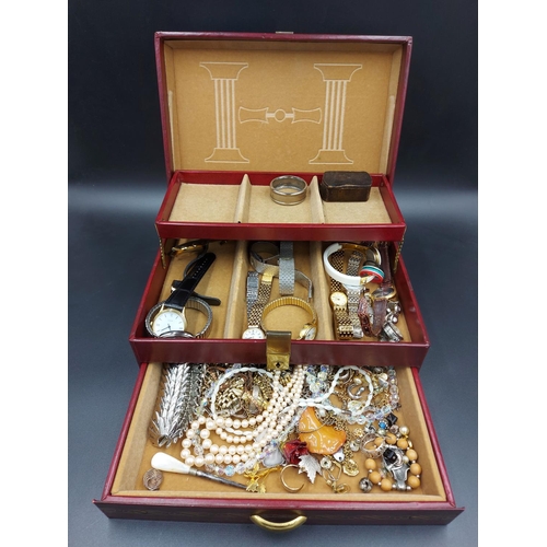 187 - A jewellery box containing various wristwatches and costume jewellery to include a mid 20th century ... 