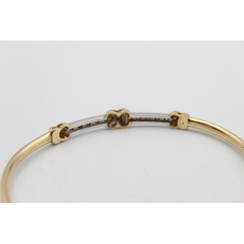 105 - A 10ct gold diamond set bangle - approx. gross weight 5.8 grams