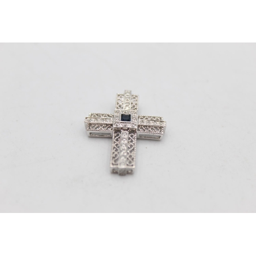 109 - A 9ct white gold diamond and sapphire religious cross pendant - approx. gross weight 2.2 grams