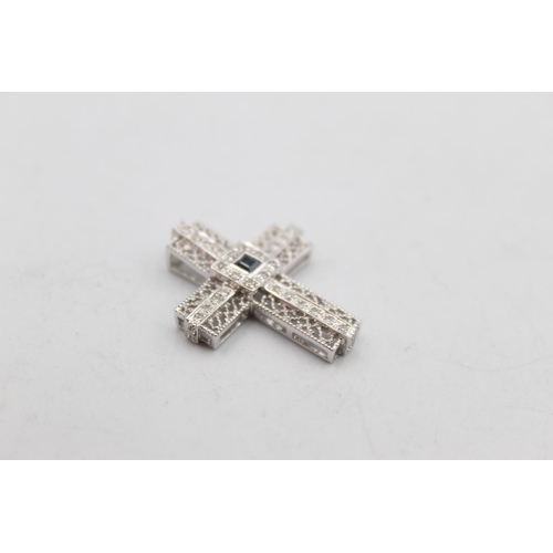 109 - A 9ct white gold diamond and sapphire religious cross pendant - approx. gross weight 2.2 grams