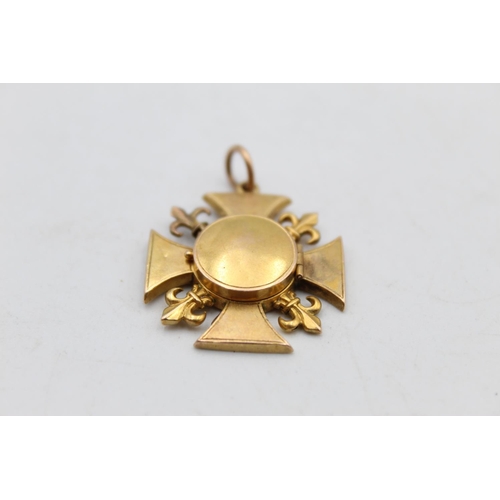 112 - An 18ct gold fleur-de-lis fob medallion with locket - approx. gross weight 4.6 grams