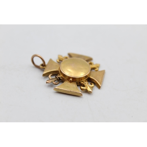 112 - An 18ct gold fleur-de-lis fob medallion with locket - approx. gross weight 4.6 grams