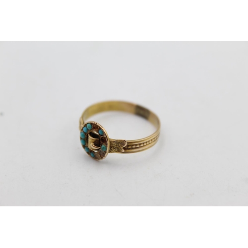 121 - A 15ct yellow gold turquoise set buckle motif ring, size U½ - approx. gross weight 2.5 grams