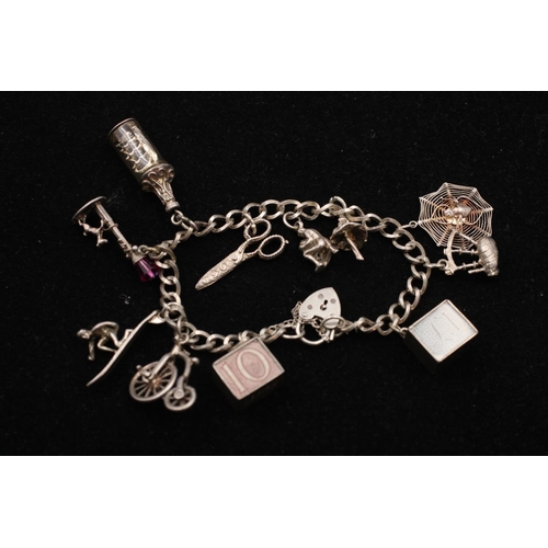 139 - A 925 sterling silver charm bracelet with heart padlock and animals - approx. gross weight 32 grams ... 