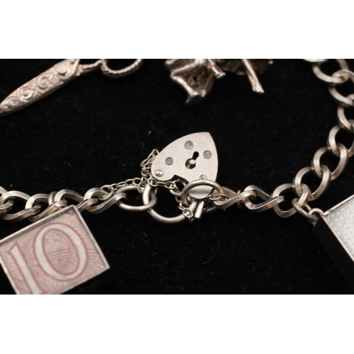 139 - A 925 sterling silver charm bracelet with heart padlock and animals - approx. gross weight 32 grams ... 