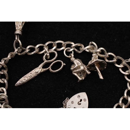 139 - A 925 sterling silver charm bracelet with heart padlock and animals - approx. gross weight 32 grams ... 