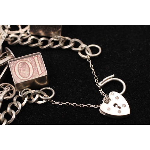 139 - A 925 sterling silver charm bracelet with heart padlock and animals - approx. gross weight 32 grams ... 