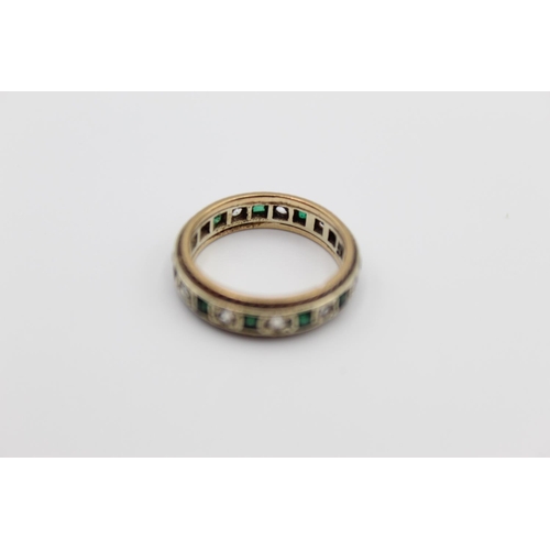 14 - A 9ct gold emerald paste eternity ring, size M ½ - approx. gross weight 3.7 grams