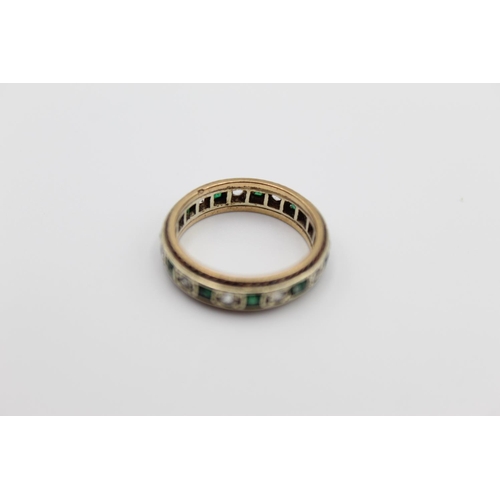 14 - A 9ct gold emerald paste eternity ring, size M ½ - approx. gross weight 3.7 grams