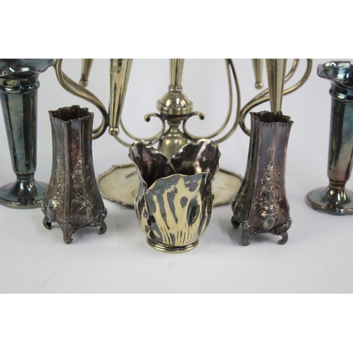 483 - Eight vintage silver plated vases to include Elkington, epergne vase etc.