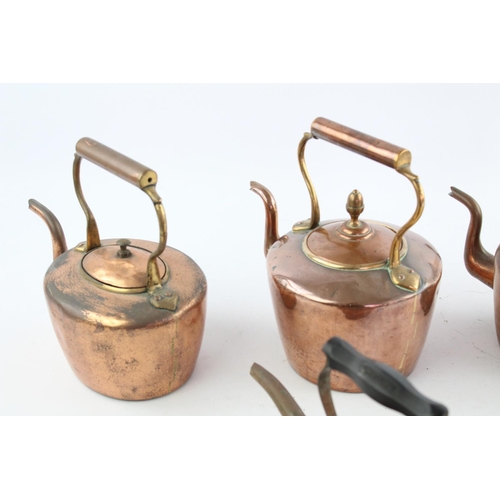 484 - Four various copper kettles to include two 19th century Soutterware examples