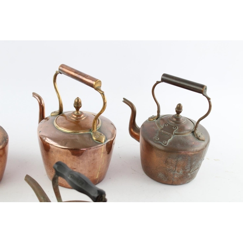 484 - Four various copper kettles to include two 19th century Soutterware examples