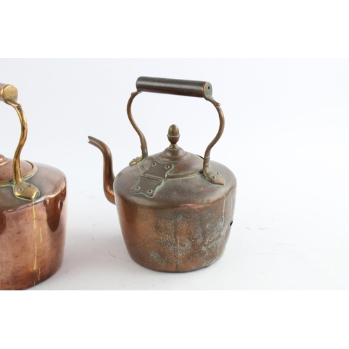 484 - Four various copper kettles to include two 19th century Soutterware examples